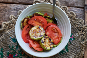 Salad with grilled zucchini and tomato.