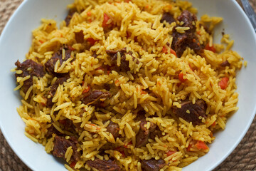 Pilaf. Side view, close-up, wooden background.