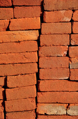 Fototapeta premium Detail close-up red brick background texture vertikal