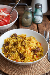 Pilaf. Side view, close-up, wooden background.
