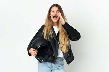 Woman holding a motorcycle helmet isolated on white background shouting with mouth wide open
