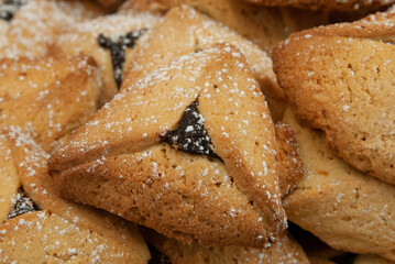 Traditional triangle-shaped cookies baked in celebration of the Jewish holiday of Purim. 