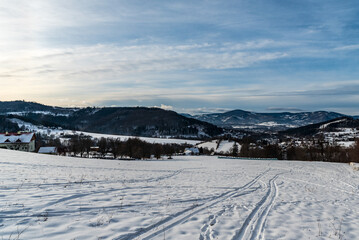 Nydek and Bystrice villages with hills of Slezske Beskydy and Moravskoslezske Beskydy mountains during winter - obrazy, fototapety, plakaty