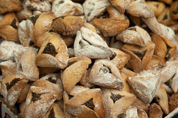 Traditional triangle-shaped cookies, called Hamentashen, baked in celebration of the Jewish holiday...