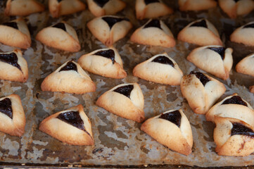 Traditional triangle-shaped cookies baked in celebration of the Jewish holiday of Purim. 