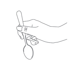 female hand holding a spoon