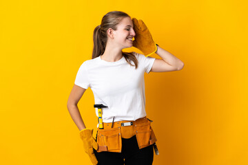 Young electrician woman isolated on yellow background has realized something and intending the solution
