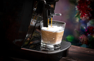 Preparing a fresh cappuccino with a home coffee machine. Coffee preparation.
