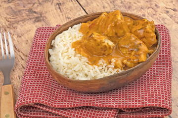 curry chicken dumpling with rice on a plate	