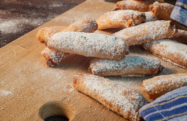 Homemade cookies with fruit jam and cottage cheese on a light wooden background. A close photo. Dessert for breakfast.