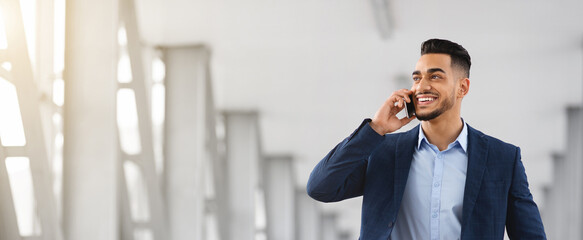 Business Call. Handsome Young Arab Man Talking On Mobile Phone