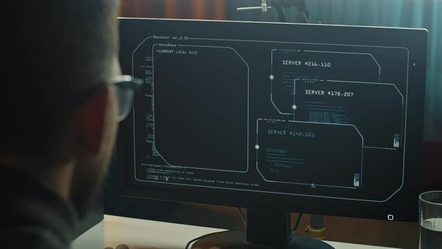 Cybercrime, hacking and technology concept. male hacker writing code or using computer virus program for cyber attack 