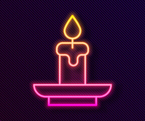 Glowing neon line Burning candle icon isolated on black background. Cylindrical aromatic candle stick with burning flame. Happy Halloween party. Vector