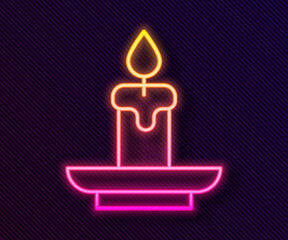 Glowing neon line Burning candle icon isolated on black background. Cylindrical aromatic candle stick with burning flame. Happy Halloween party. Vector