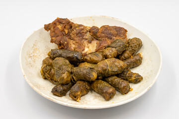 Meat leaf wrapping. Traditional Mediterranean flavor. Wrapping leaves on a white background. local name etli yaprak sarma