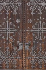 Antique wooden door with elaborate iron works. Budapest, Hungary