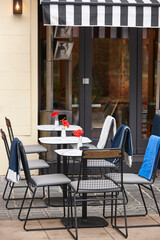 Coffee shop cafeteria outdoor furniture with blankets in winter time