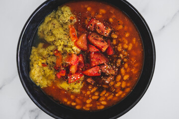 vegan baked beans and chickpea flour frittata with tomato salsa topping, healthy plant-based food