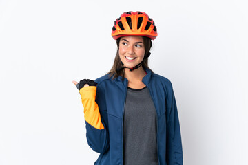 Young cyclist brazilian girl isolated on white  background pointing to the side to present a product