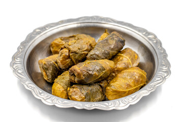 Meat leaf wrapping. Traditional Mediterranean flavor. Wrapped leaves with yogurt on a white background. local name etli yaprak sarma