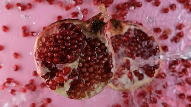 Pomegranate. Slowmotion video. Pomegranate seeds