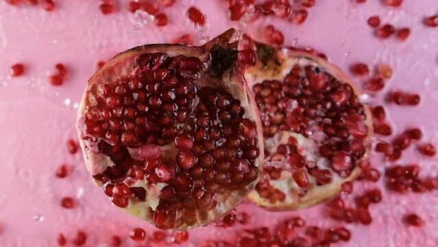 Pomegranate. Slowmotion video. Pomegranate seeds