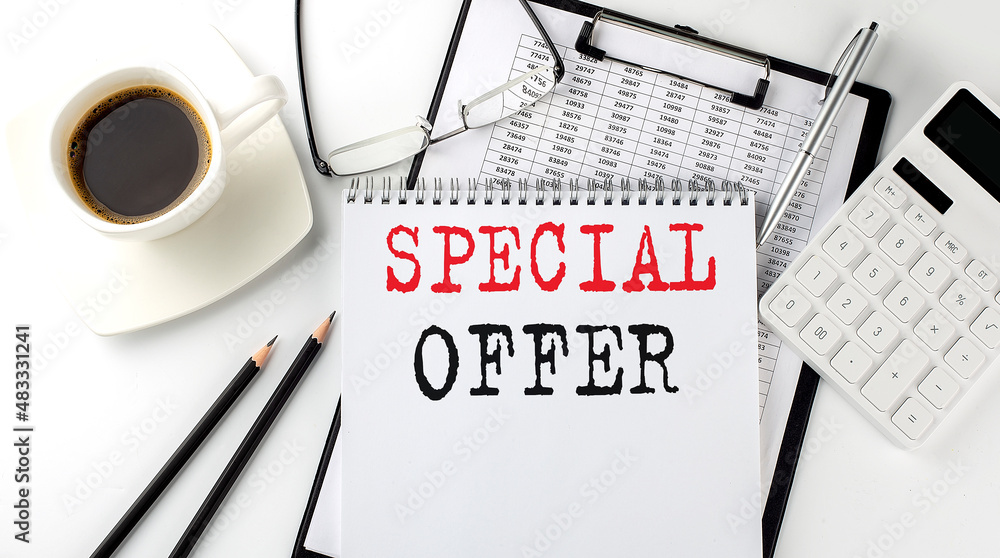 Poster special offer text on the paper with calculator, notepad, coffee ,pen with graph