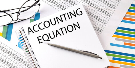 ACCOUNTING EQUATION , pen and glasses on the chart, business concept