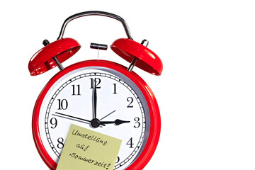Wecker mit Klebezettel und der Notiz 