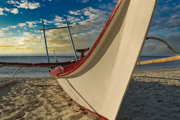 Banka fishing boat on the beach. Late tropical  afternoon in the Philippines