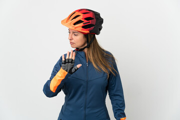 Middle age cyclist woman isolated on white background making stop gesture and disappointed