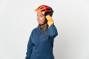 Middle age cyclist woman isolated on white background doing surprise gesture while looking to the side