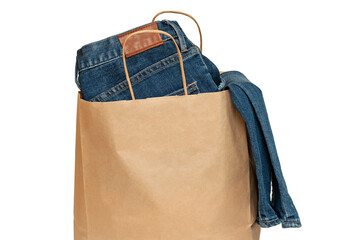 Jeans in a paper bag on a white background