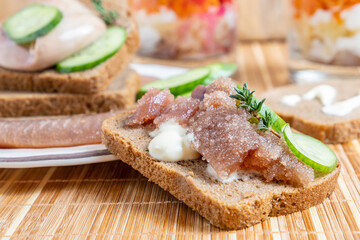Herring roe (herring eggs) with fresh thyme on dark bread.