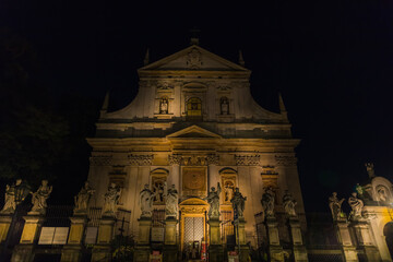 Fototapeta na wymiar Church of the Apostles Peter and Paul on Grodzka Street in Krakow, Poland. Night view.