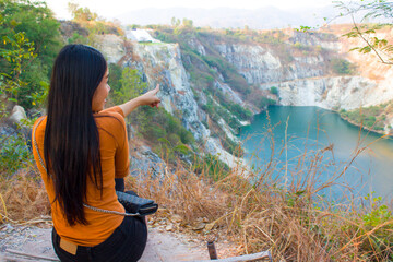 Beautiful asian girl exploring Canyon in Thailand