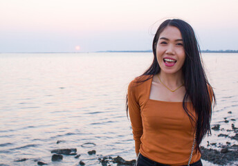 Happiness woman is enjoying serene ocean nature