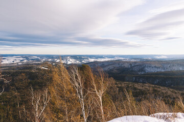 Panoramic view from the top of a frozen volcano over the winter valleys