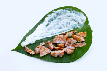 Chewing betel nut, Betel nut with cal lime powder on betel leaves
