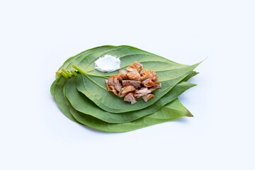 Chewing betel nut, Betel nut with cal lime powder on betel leaves