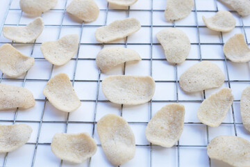 Prawn crackers on white background. Shrimp crispy rice snack