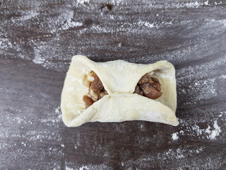 step-by-step instructions for cooking the national dish manty.manty is a dish made of dough and...