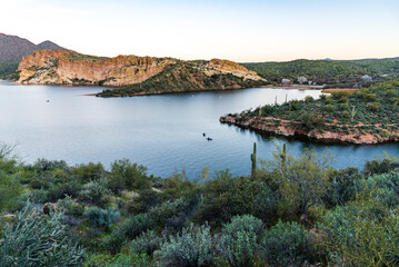 View from the Butcher Jones Hiking Trail of people kayaking on Saguaro Lake.