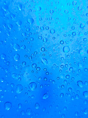semi-abstract close up of water droplets on a deep blue background