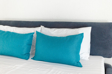 some pillows on a beautiful double bed in the bedroom