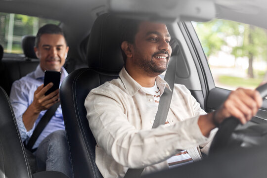 transportation, vehicle and people concept - happy smiling indian male driver driving car with passenger
