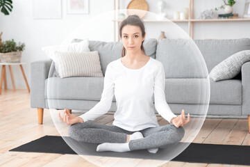 Fototapeta na wymiar Calm young european woman practicing yoga in living room interior in protective bubble