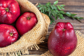 Red apples on a dark, wooden background. Selective focus. Harvesting. Healthy food.