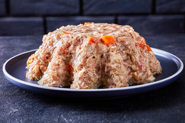 meat aspic, jellied slow cooked meat on a plate