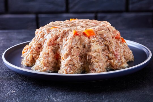 meat aspic, jellied slow cooked meat on a plate